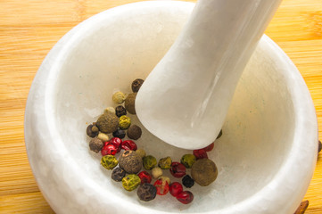 mortar and pestle with peppercorn mix