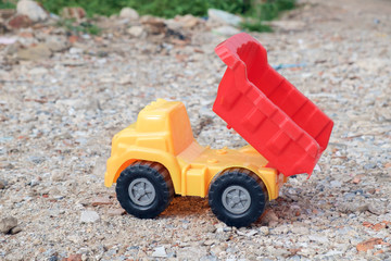 Toy dump truck / View of toy dump truck on the ground.