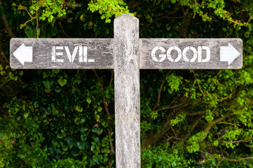 Evil versus Good directional signs