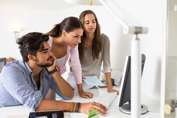 Group of young startup workers  working on new project.