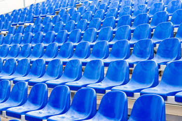 Empty blue stadium seats
