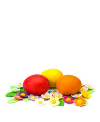 Fototapeta na wymiar Easter eggs and sugar flower on white background with space for text