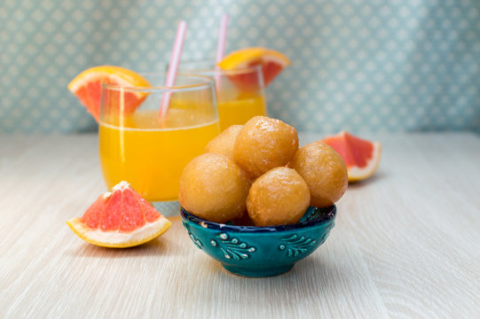 Sweet fried dough balls with honey