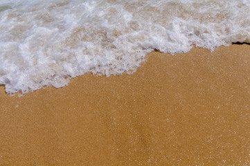 Foam wave on sea close with beach