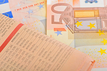 Close-up newspaper with of Euro banknotes