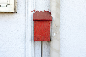 Handmade wooden box on the exterior wall