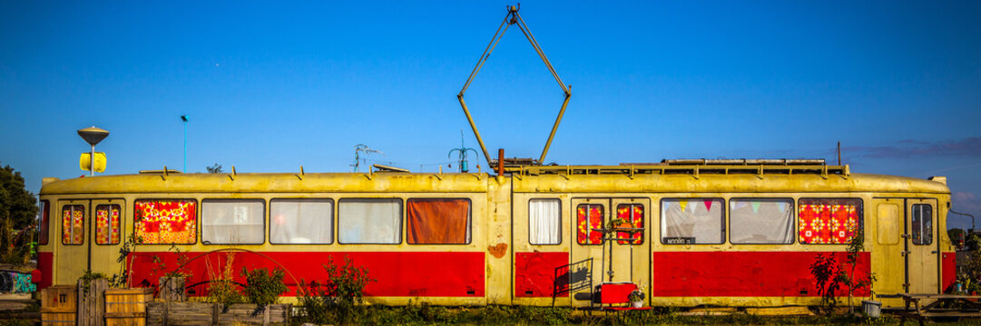 AMSTERDAM - AUGUST 15: Old living tram on NDSM-werf - city-sponsored art community called Kinetisch Noord, center for underground culture in Amsterdam on August 15, 2010 in Amsterdam, Netherlands