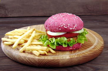 Pink hamburger and fries