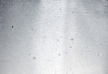 aluminum surface with drops of water