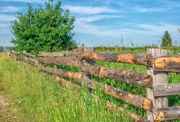Fototapeta na wymiar wooden fence in village