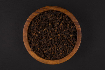 Clove spice in wooden bowl