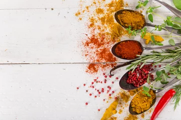 Photo sur Plexiglas Herbes Various colorful spices on wooden table