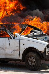 Obraz na płótnie Canvas burning car burning car - Exercise firefighters