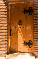 Yellow wooden door with locks 