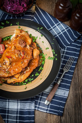 Potato pancakes with meat stew served on a plate.