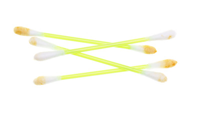 dirty ear sticks on a white background