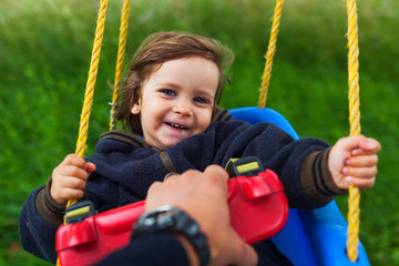  Pulling baby in swing