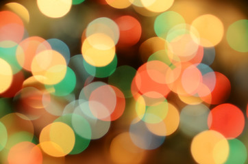 Bright christmas eve background. Plenty of golden sparkling bokeh from defocused garland lights.