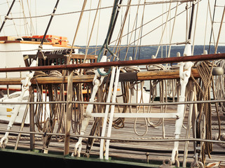 Fragment of deck pleasure craft. Ropes and rope