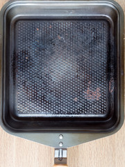 Top view of a square used iron pan