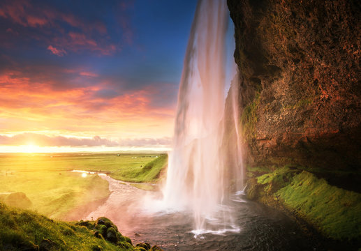 Fototapeta Seljalandsfoss waterfall at sunset, Iceland