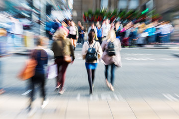 crowd of people crossing a street with zoom effect