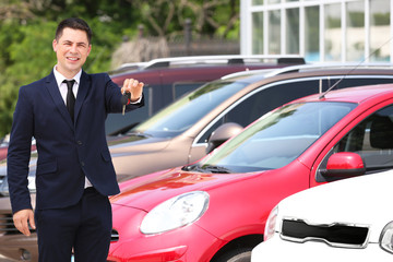 Fototapeta na wymiar Man with car key outdoors