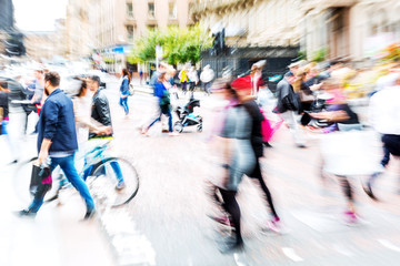 crowd of people crossing a street with zoom effect