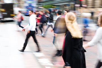 crowd of people crossing a street with zoom effect