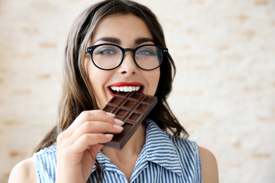 Beautiful Girl Eating Chocolate, Closeup