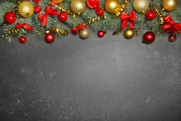 Christmas composition with fir tree branches and festive decoration on gray background
