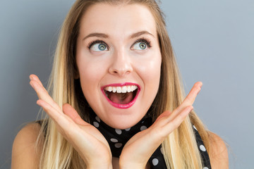 Surprised young woman posing