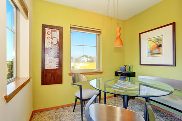 Modern dining room interior with glass table.
