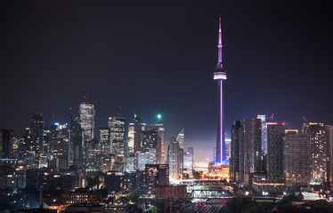 Urban lighted landscape of Toronto.   A balcony view of  lighted streets, parks, buildings and office towers on a hot & humid August night in capitol of Ontario, Canada.
