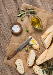 Virgin olive oil and bread, above view.