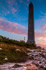 High Point State Park Veterans Memorial Monument at sunset with the moon appearing on the side