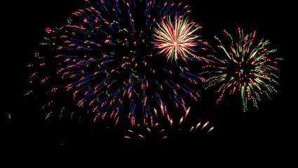 Fireworks display with reflections on the water