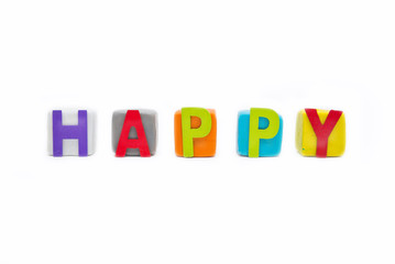 word Happy by wooden letter on clay