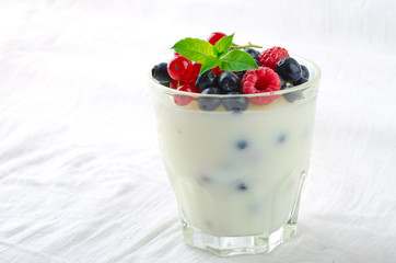 Sweet dessert, pudding, panna cotta with mix berries and mint