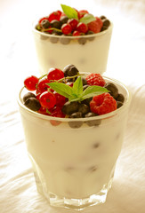 Sweet dessert, pudding, panna cotta with mix berries and mint
