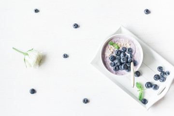 Healthy breakfast with yogurt, muesli and blueberry. Top view, flat lay