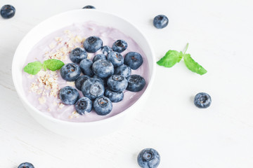 Healthy breakfast with yogurt, muesli and blueberry