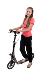 A teenager-girl with a kick scooter in studio © anrymos