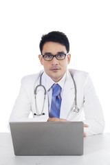 Doctor with glasses and laptop