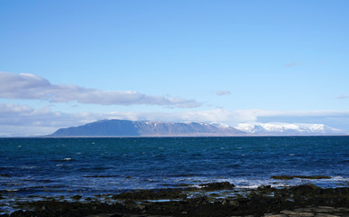 Beautiful coast with snow mountain background at Reykjavik City