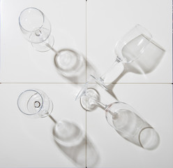 set of wine glasses on a white background shot from above with reflection