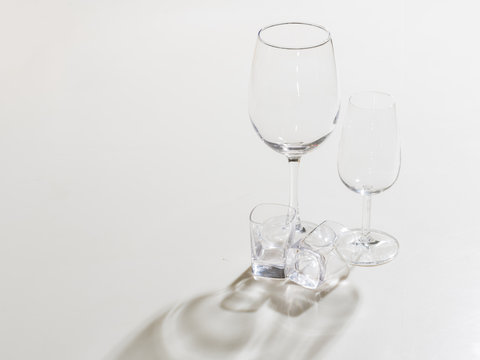 set of wine glasses on a white background shot from above with reflection
