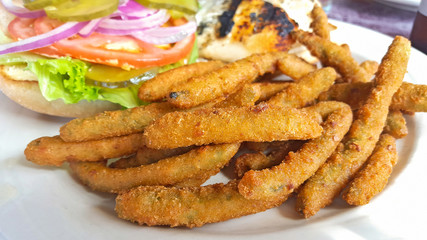deep fried beans with chicken sandwich on white plate