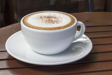 hot coffee on wood table