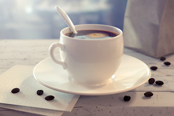 Realistic 3d render of coffee cup with spoon on the wooden table with paper bag, beans and napkin